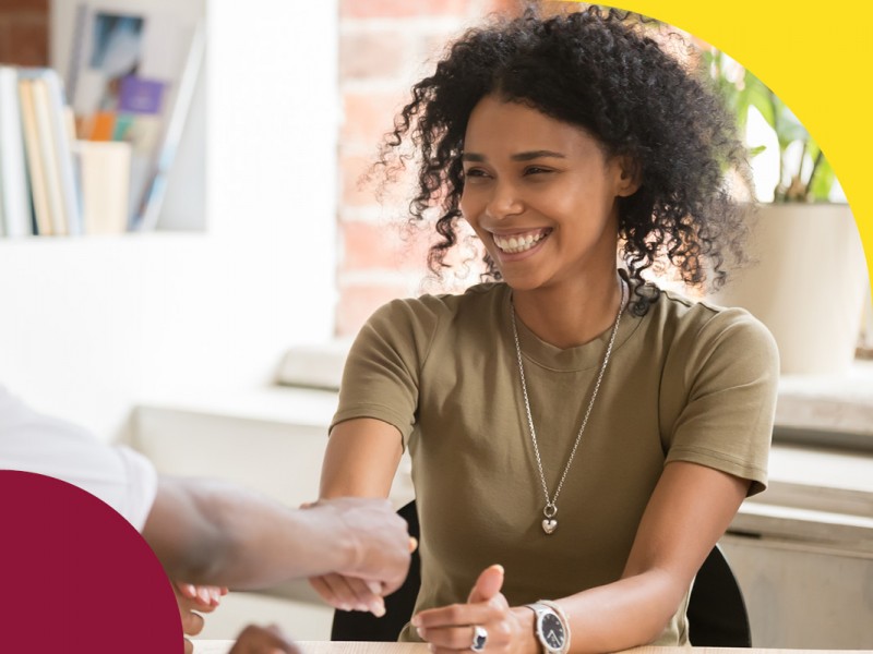 team at desks talking